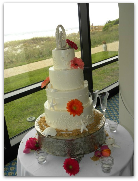  to add a pop of color to an otherwise simple white beach wedding cake is 